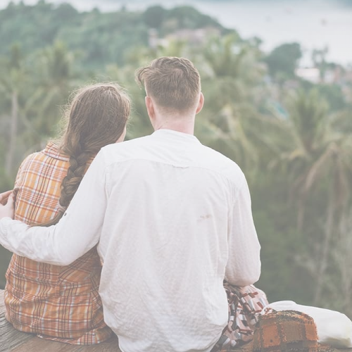 a couple looking into the green background